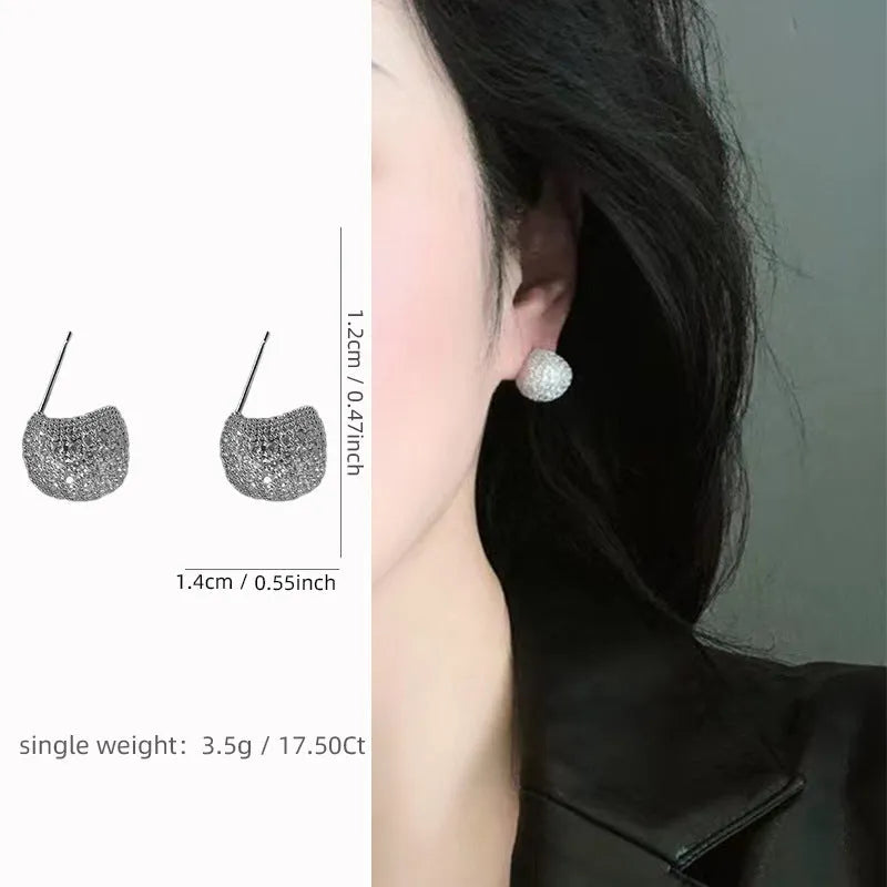 Golden beans shaped clip earrings with diamond crystals in drop geometric design