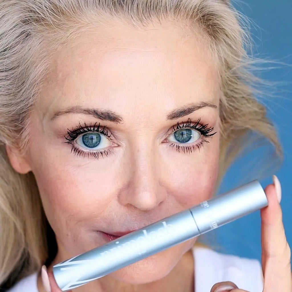Black double-ended eyelash comb and brush beauty tool for makeup application