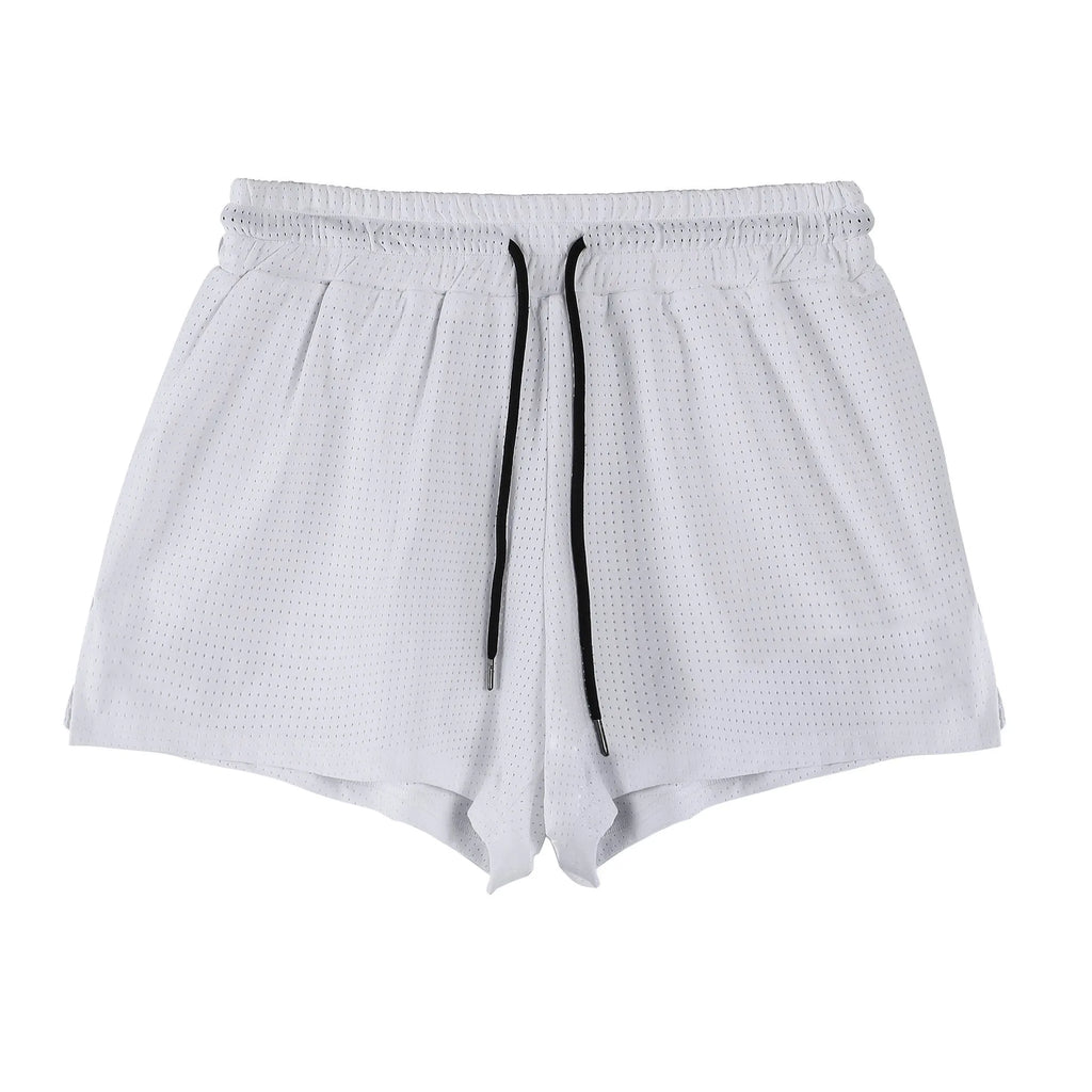 Man wearing black quick-dry nylon summer shorts with a mid-waist design.