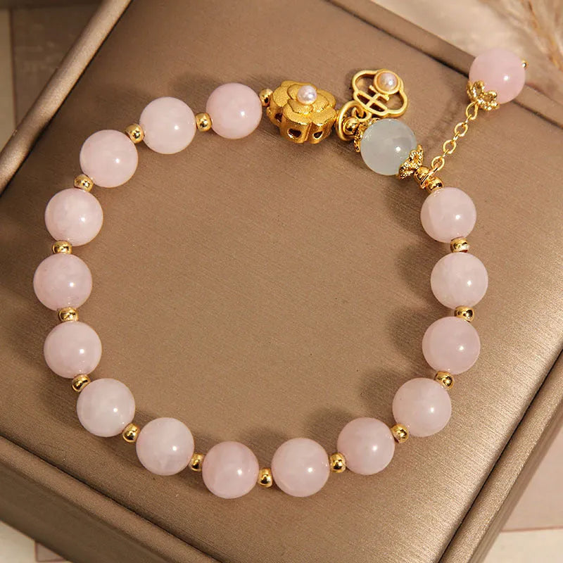 Women's pink crystal flower bracelet with refined graceful design on wrist