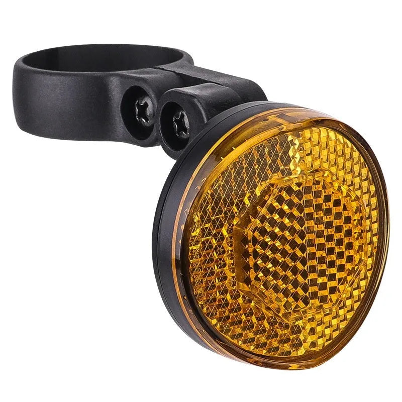 Red plastic bicycle taillight bracket mounted on seat post with reflective elements