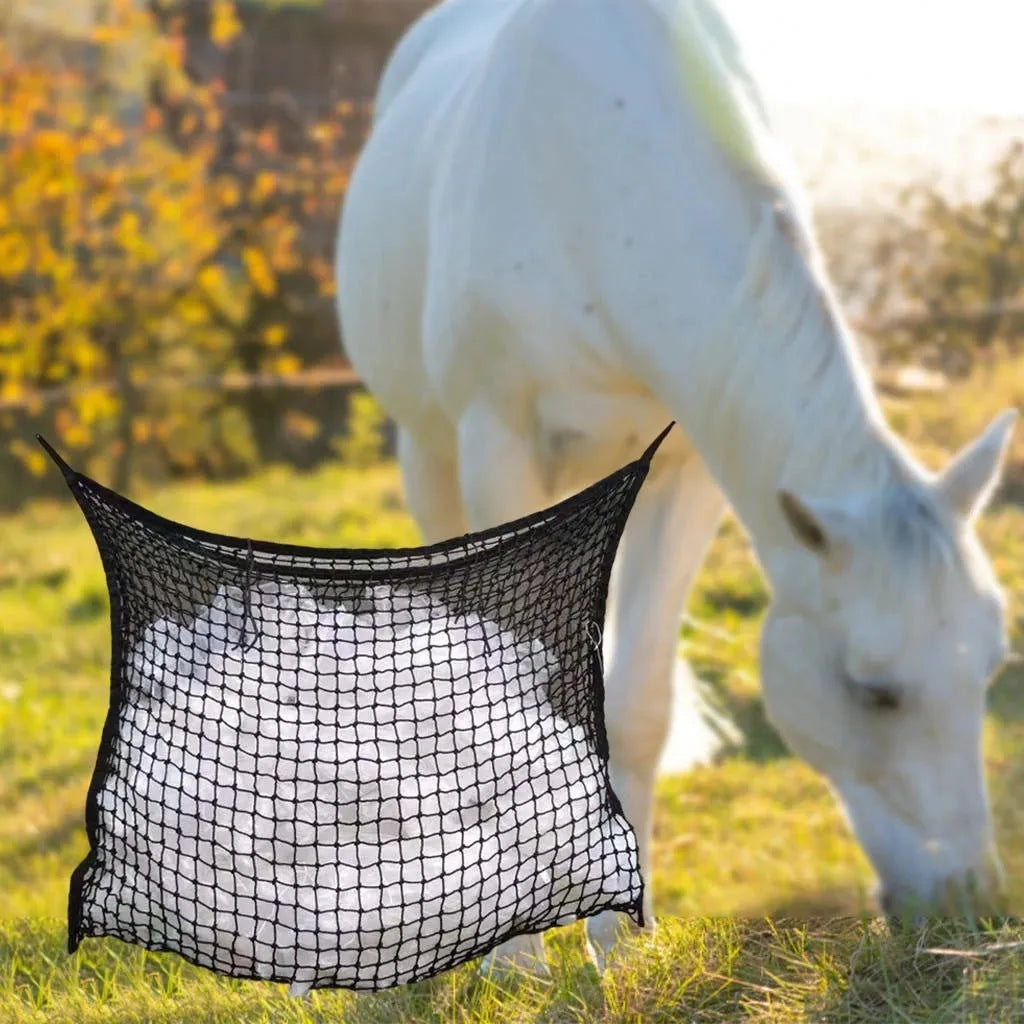 Black woven grid horse feeding bag hanging, showing size options for cattle, horses and sheep.
