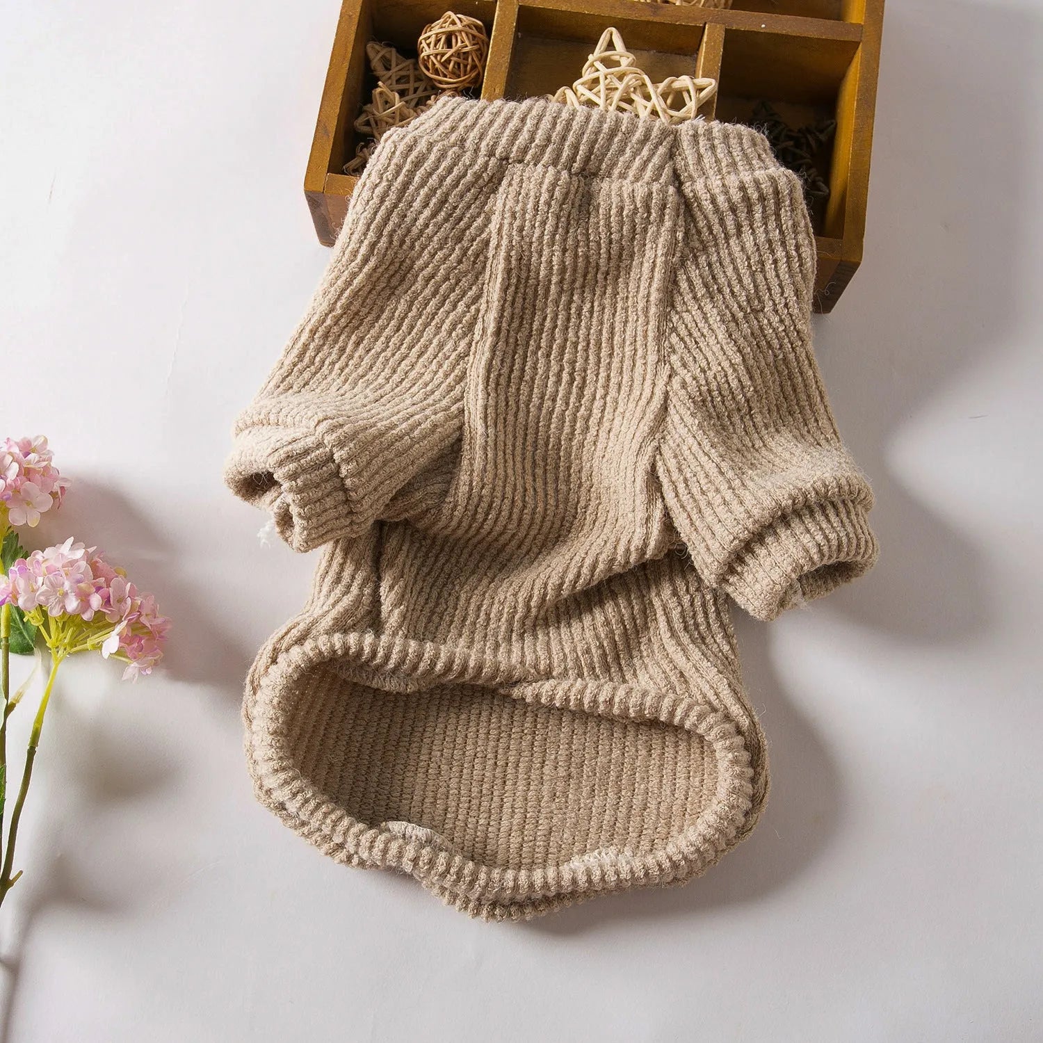 Brown cloth sweater pullover on a small dog, suitable for Bichon or Pomeranian breeds.