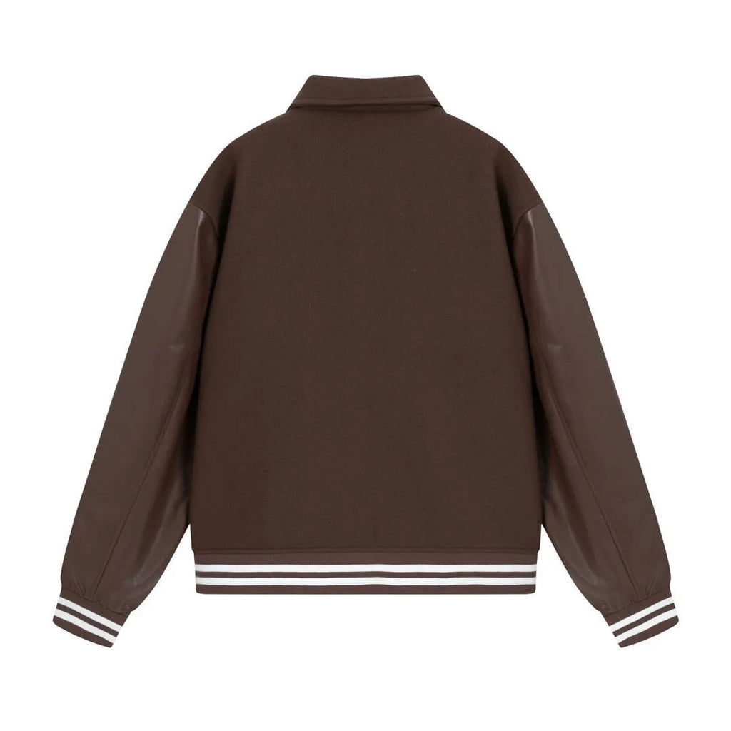 Women's apricot wool jacket with bone embroidery on the front, showing casual fit and stitch detail.