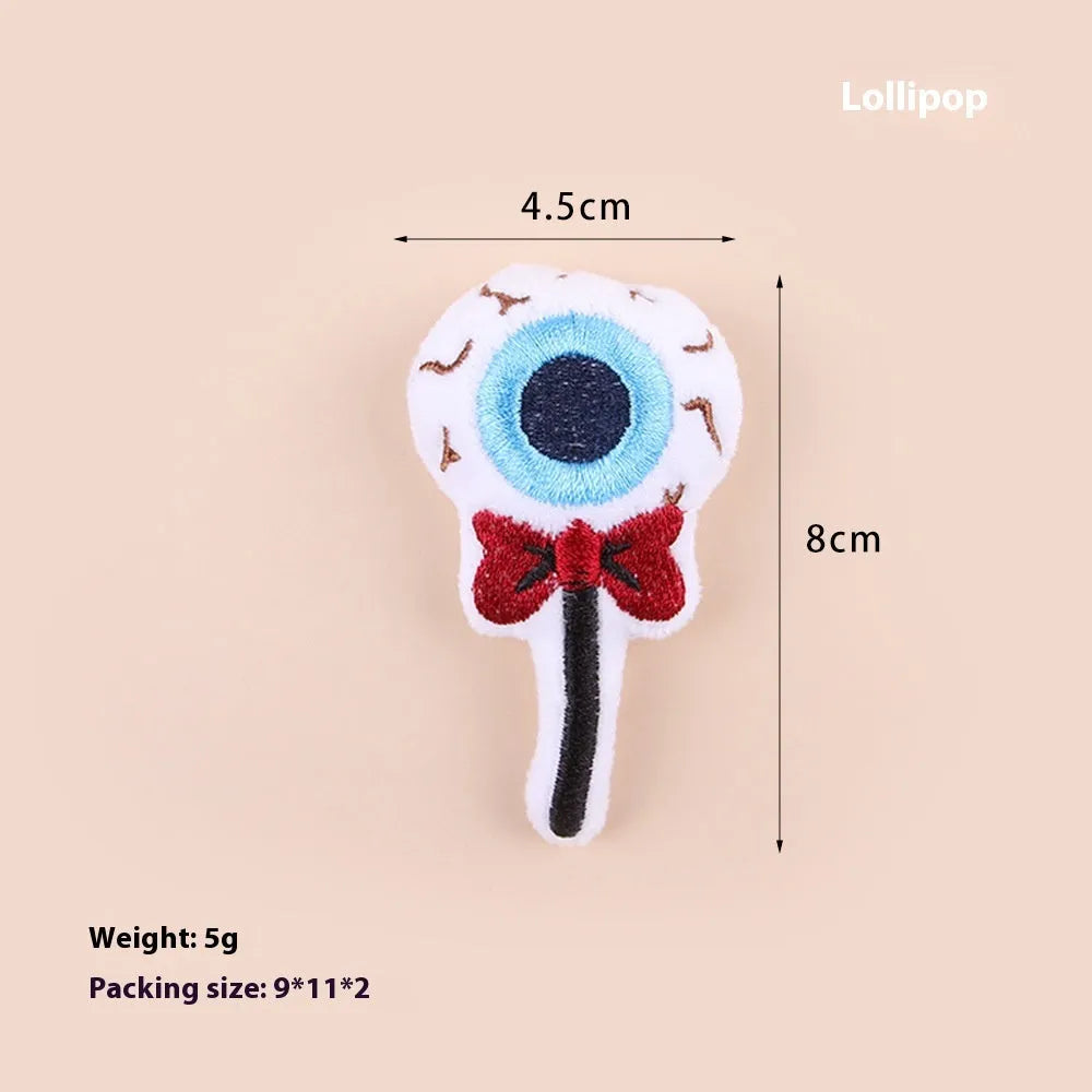 Colourful plush cat teaser wand with candy and eye-shaped attachments for interactive play