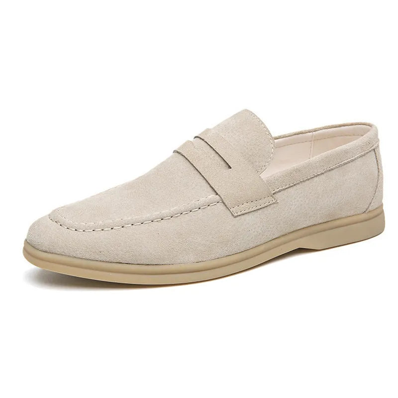 Men's beige leather slip-on casual shoes with a round toe and rubber sole.