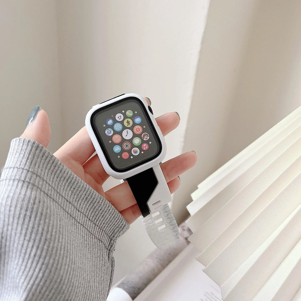 Two-tone silicone protective case for Apple Watch in black and white, fitted on a watch face