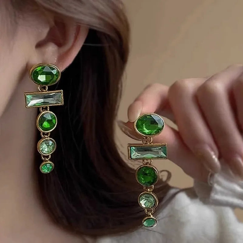 A pair of retro green gradient alloy earrings with a geometric tassel shape and inlaid zircon details.