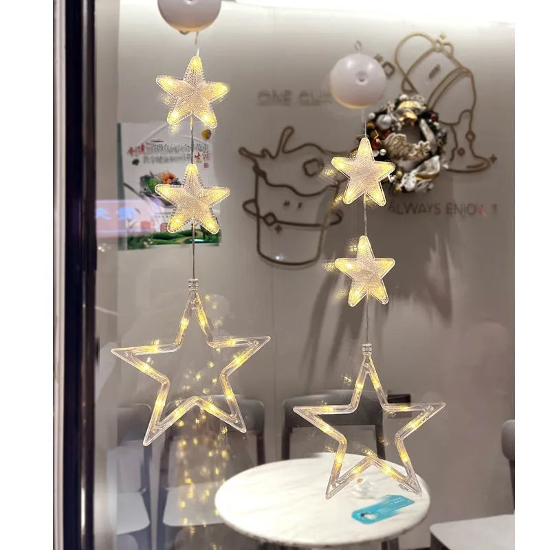 Set of three battery-powered LED Christmas pendant lights with suction cups, showing star, tree, and deer designs.