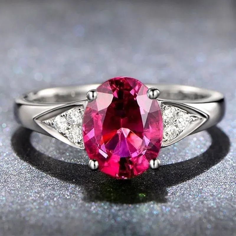 Women's court style ring set with natural blue and red zircon stone inlays in heart, water drop, and bell patterns.