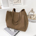 Solid colour women's canvas handbag with double shoulder straps and sandwich pocket design