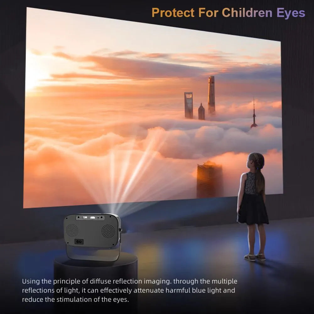 Black compact HD smart portable projector with remote control on a table.