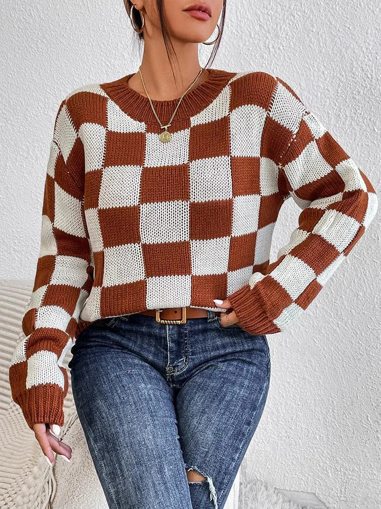 Dark brown loose pullover sweater with a chessboard plaid pattern and round neck.