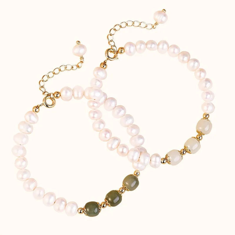 Natural freshwater pearl bracelet with diamond-shaped beads in Hetian jade colours on wrist