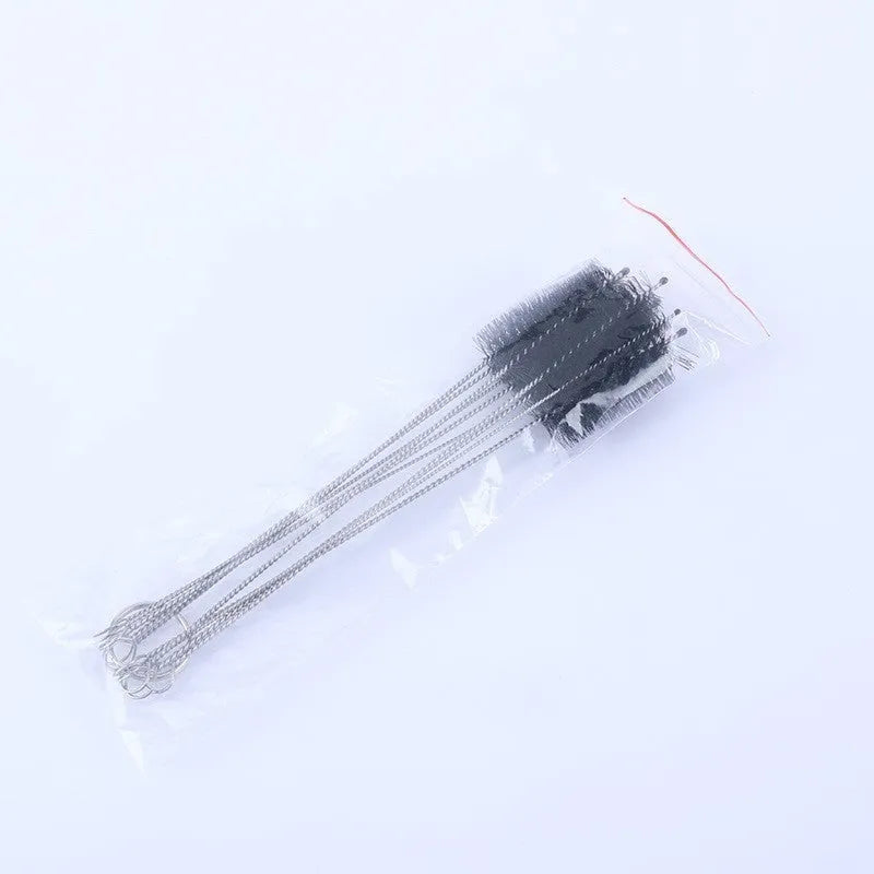 Set of thin stainless steel cleaning brushes with nylon bristles for cleaning drinking straws and bottles.
