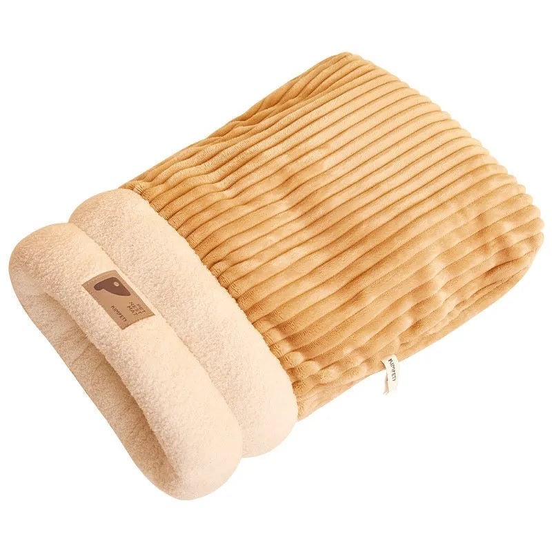 Brown semi-enclosed pet sleeping bag with plush lining on a wooden floor.