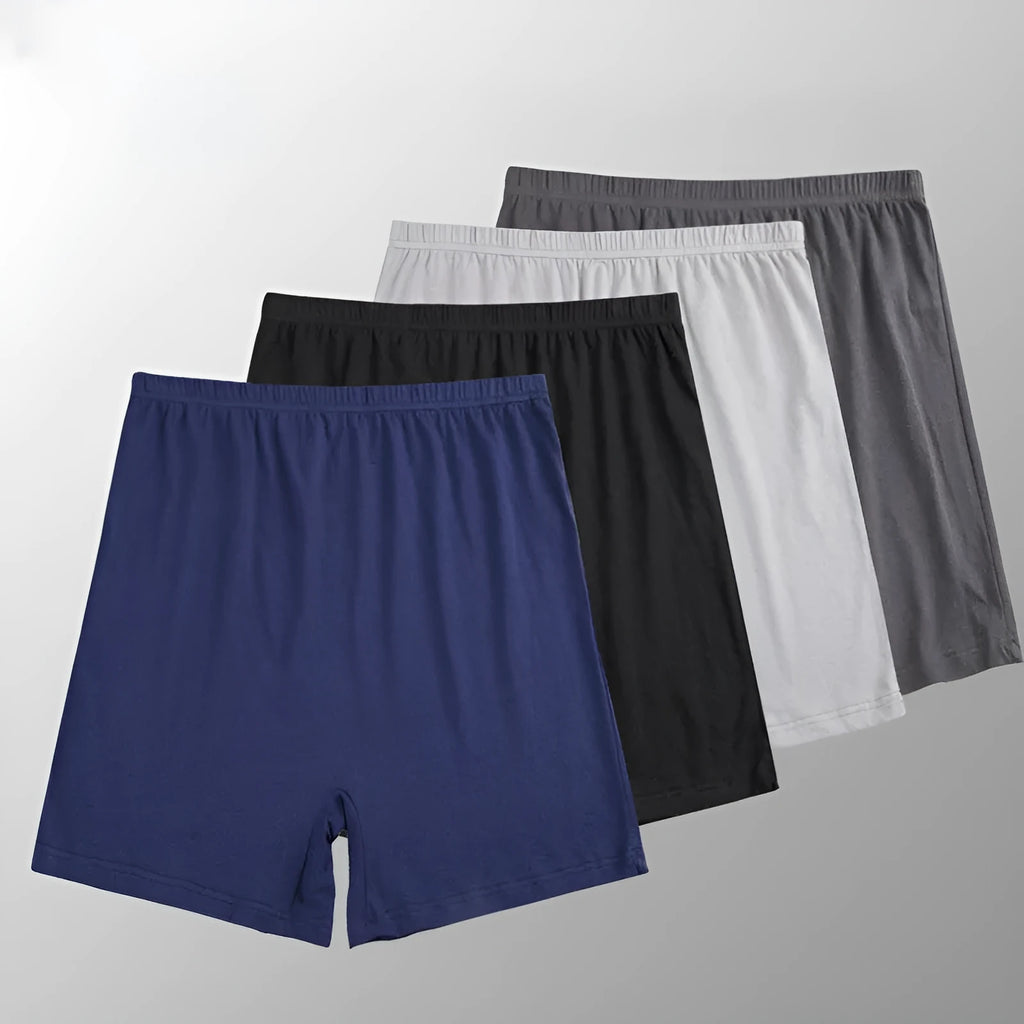 Man wearing solid colour high waist modal boxer shorts in a neutral shade.