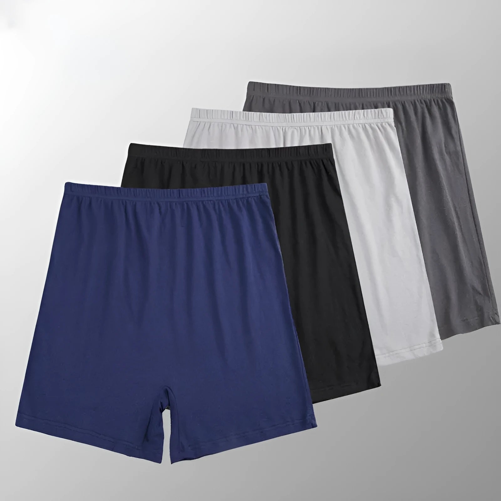 Man wearing solid colour high waist modal boxer shorts in a neutral shade.