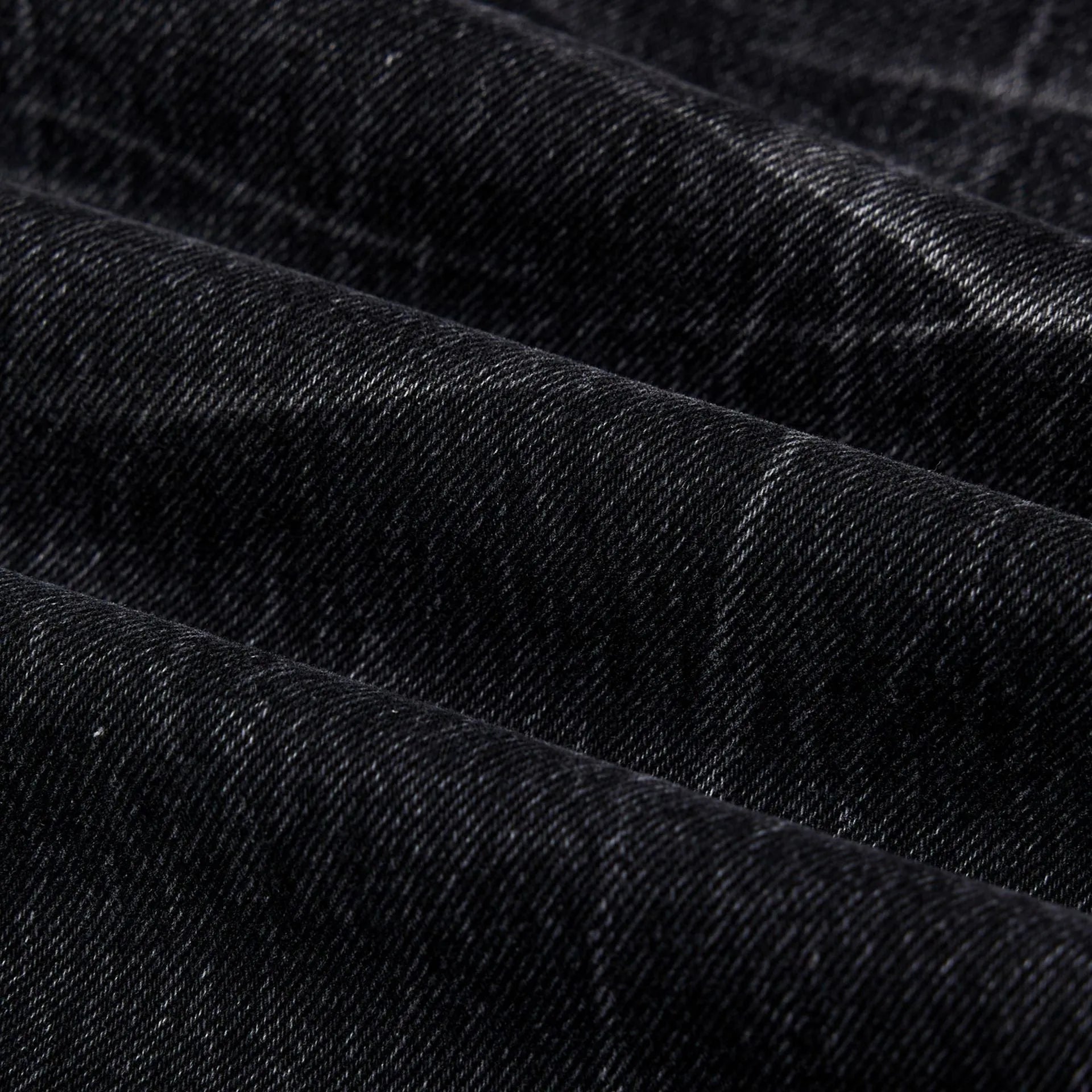 Men's black straight-leg jeans with a lightning crack wash pattern on cotton denim.