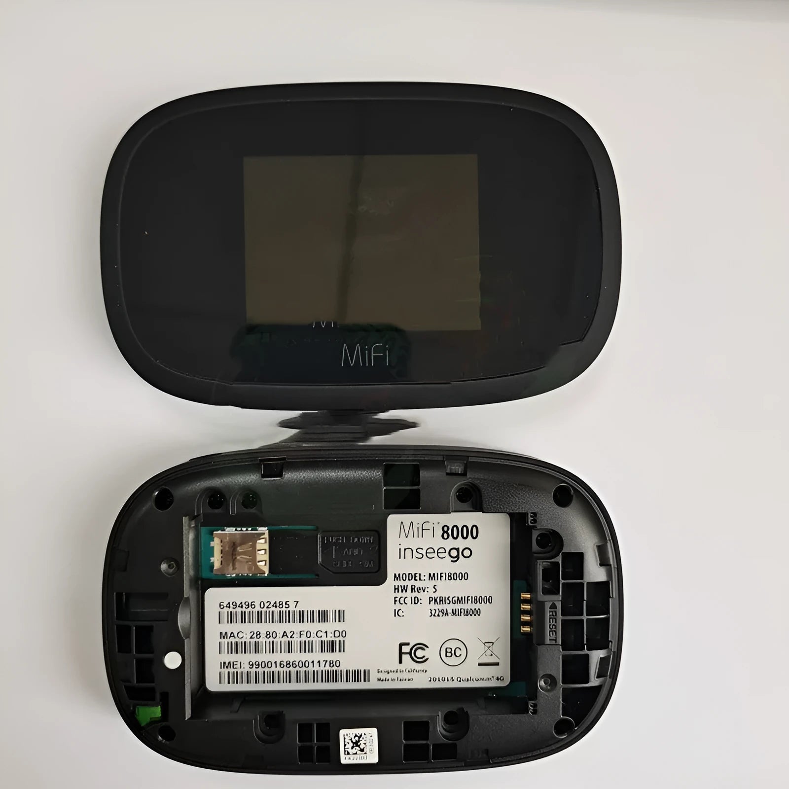 Black portable 4G wireless router with battery and cable for mobile internet access.