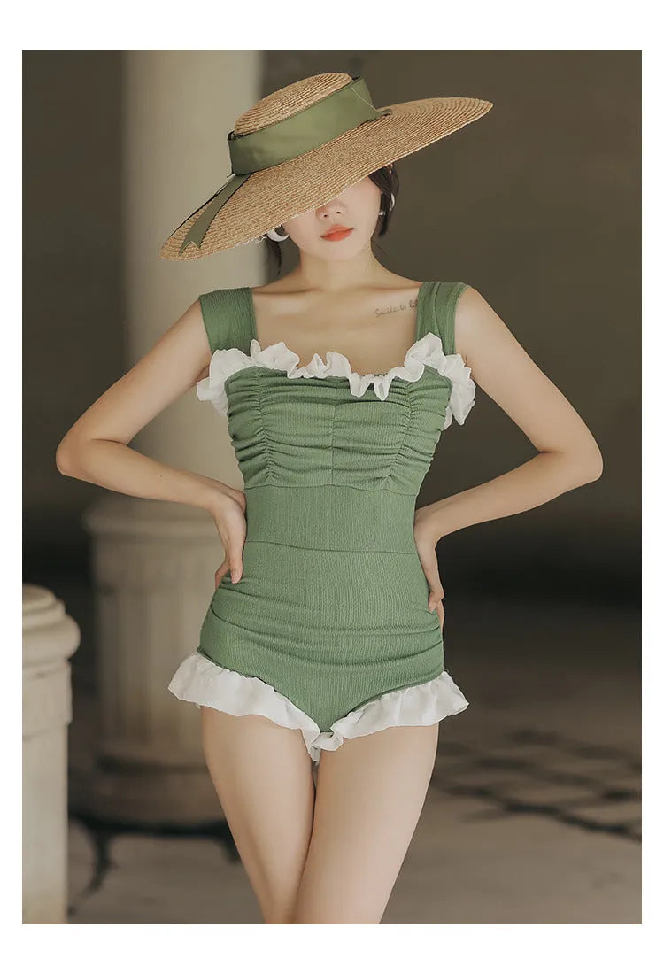 High-waist one-piece swimsuit in Korean style with slimming design available in black, pink, or green colours