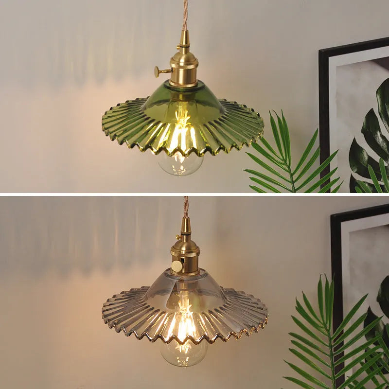 Retro brass lotus wall lamp with copper frame and glass shade on a wall