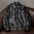 A man's black lapel short leather jacket with side pockets, shown in a loose fit.