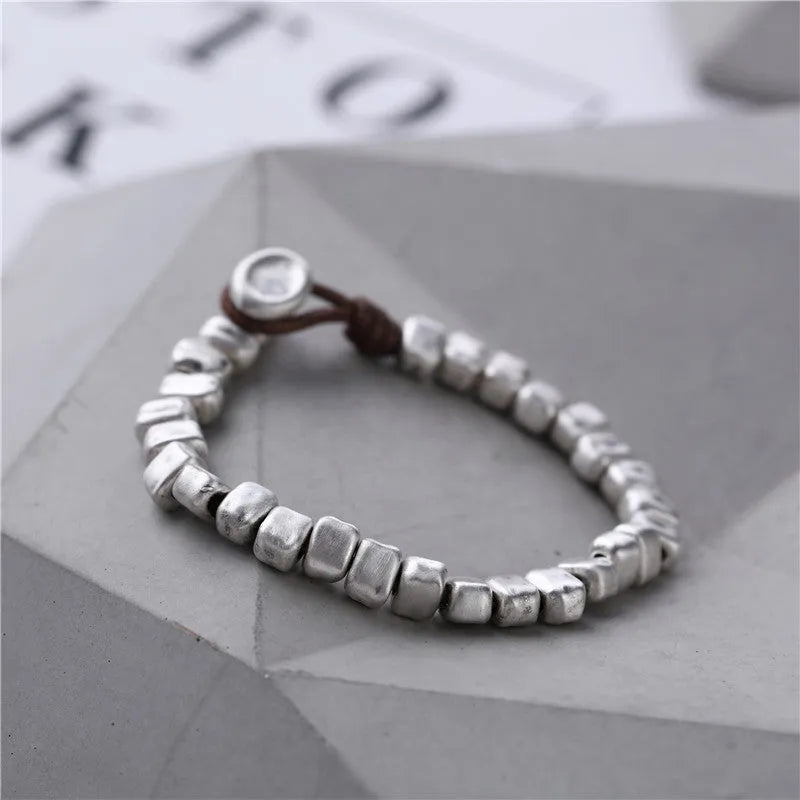 Handmade wooden women's bracelet with silver-coloured irregular square design on elastic band