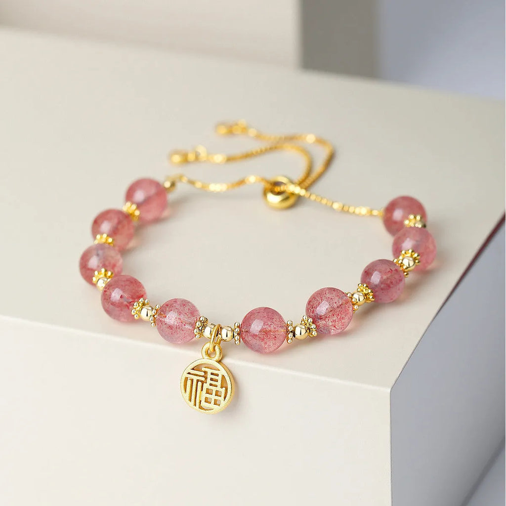 Strawberry quartz crystal bracelet with geometric shapes and fu character symbols