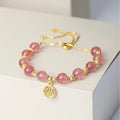 Strawberry quartz crystal bracelet with geometric shapes and fu character symbols