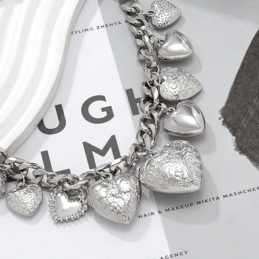 Exaggerated carved heart pendant necklace on metal chain with adjustable 41-50cm length in gold finish