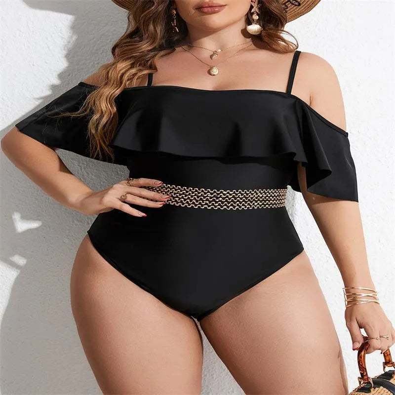 Black solid colour women's one-piece swimsuit on a hanger