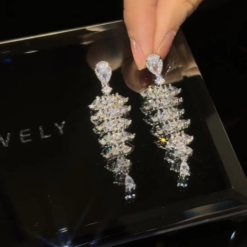 Silver pagoda colour Christmas tree drop earrings with zircon stones on copper stud setting.