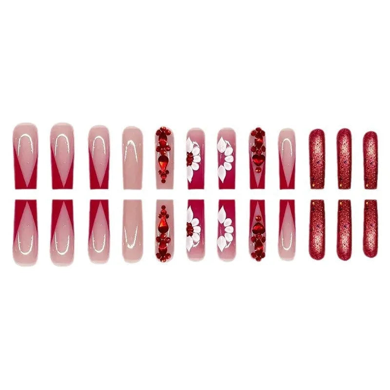 Sweet Flowers patterned fake nails with red diamonds in a long European square style.