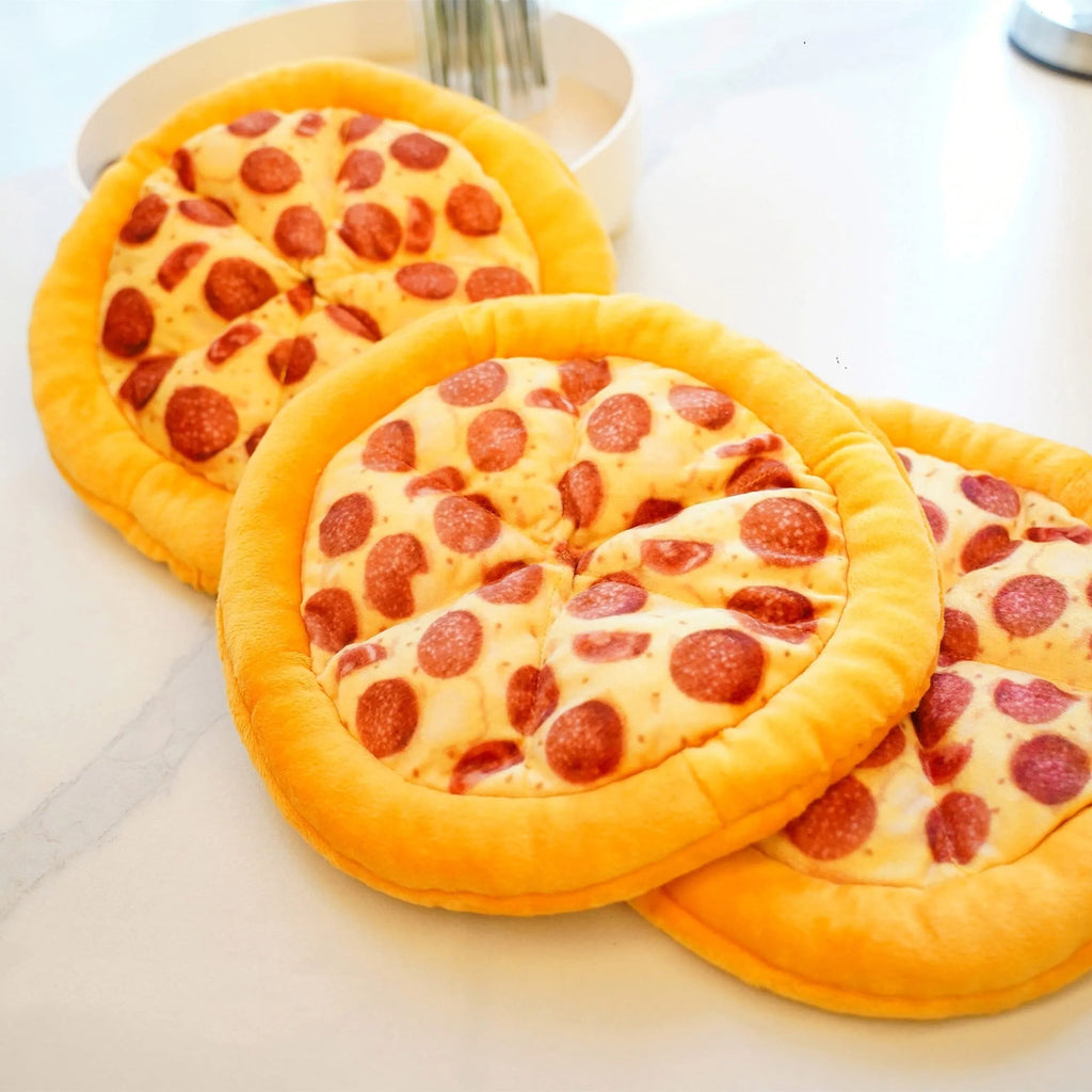 Yellow pizza slice shaped squeaky dog chew toy made from soft teddy fabric.