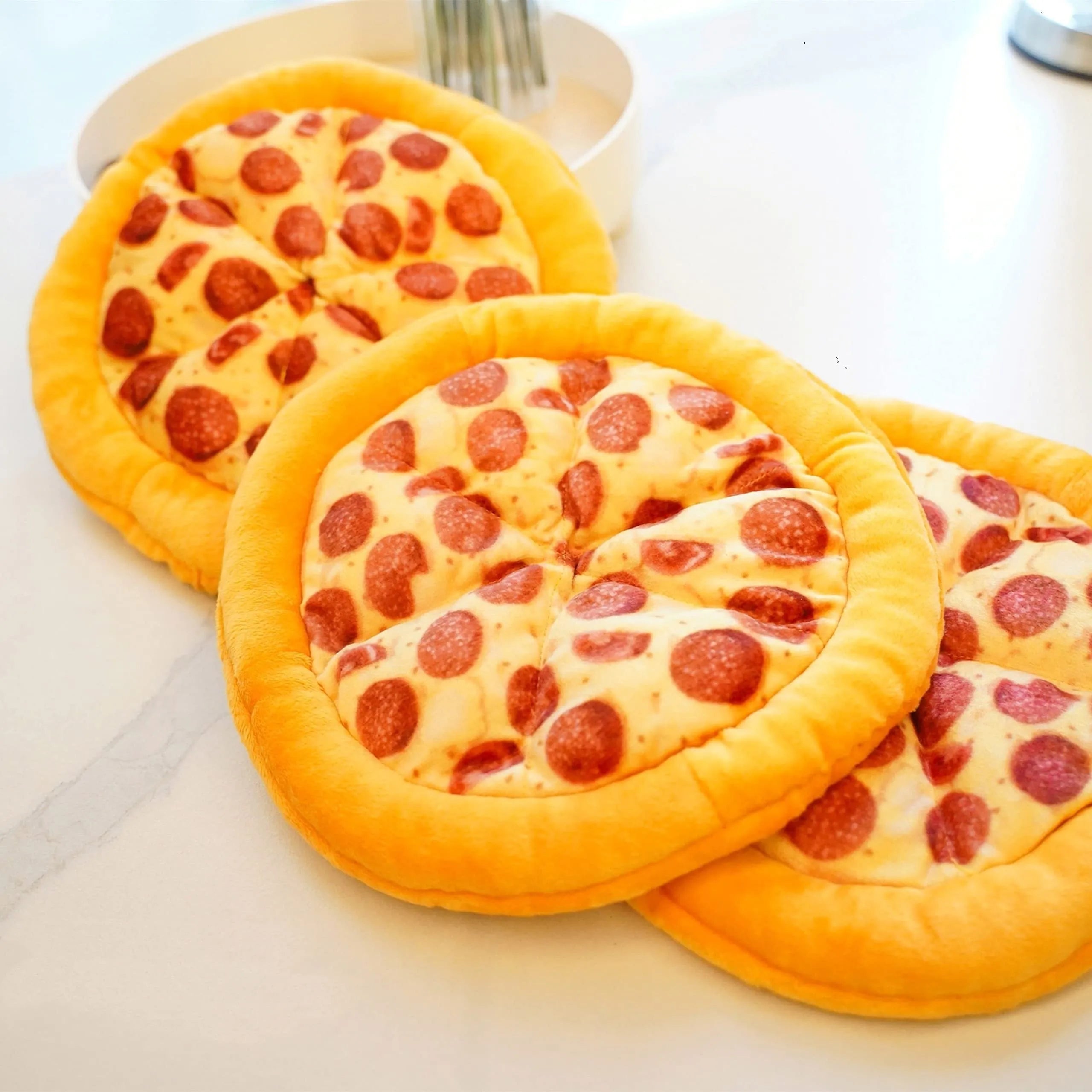 Yellow pizza slice shaped squeaky dog chew toy made from soft teddy fabric.