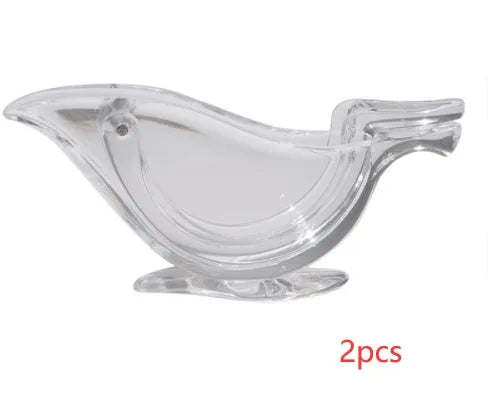 Transparent acrylic bird-shaped manual lemon juicer on a kitchen counter