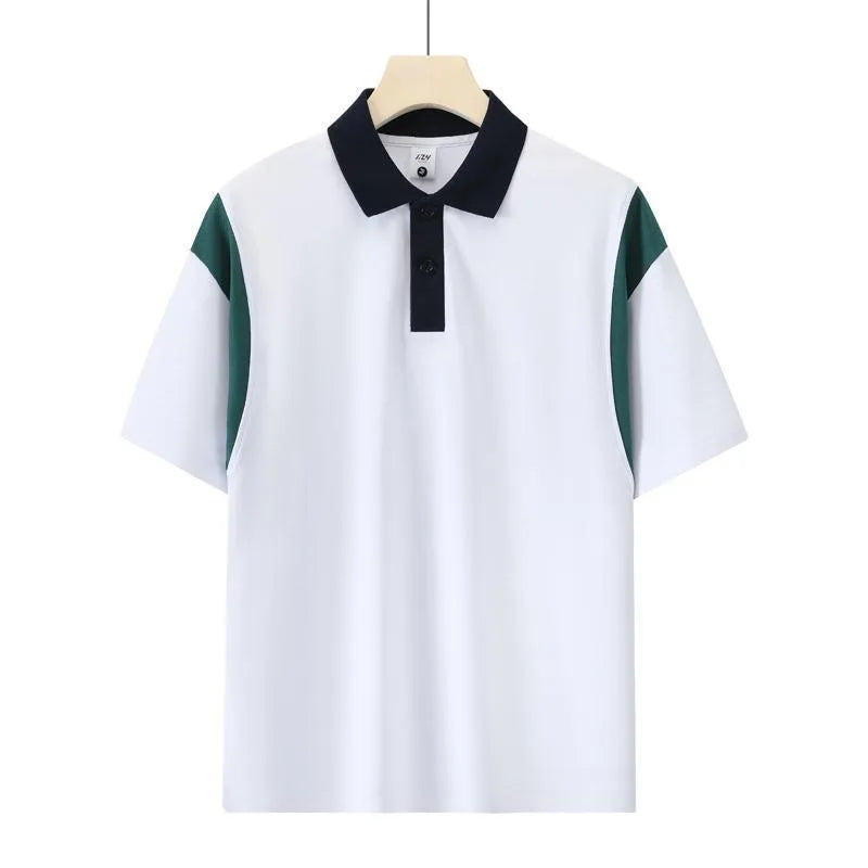 Man wearing a dark green loose-fit short sleeve cotton shirt with raglan sleeves.