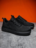 Light white thick sole casual sports shoes with mesh upper and lace-up front.