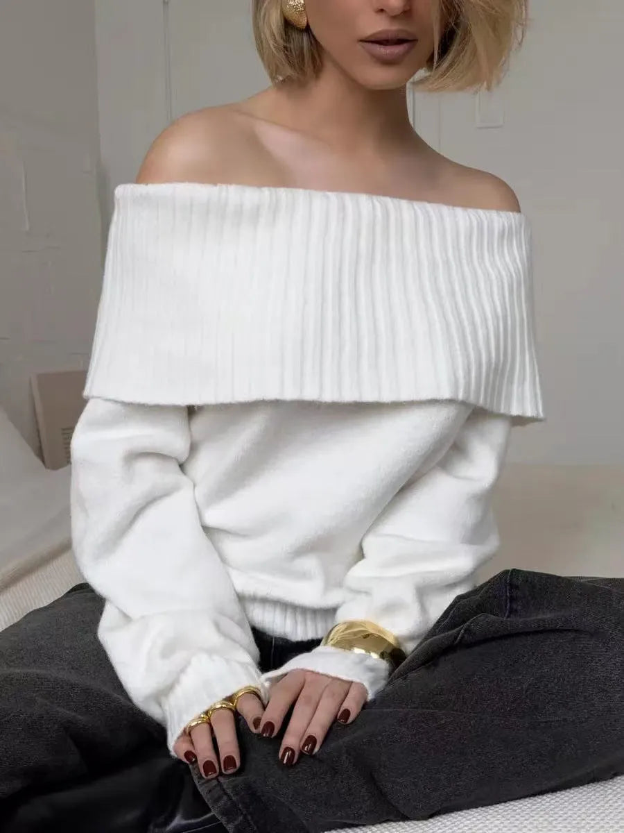 Grey off-the-shoulder pullover sweater with a textured 3D pattern on the front.