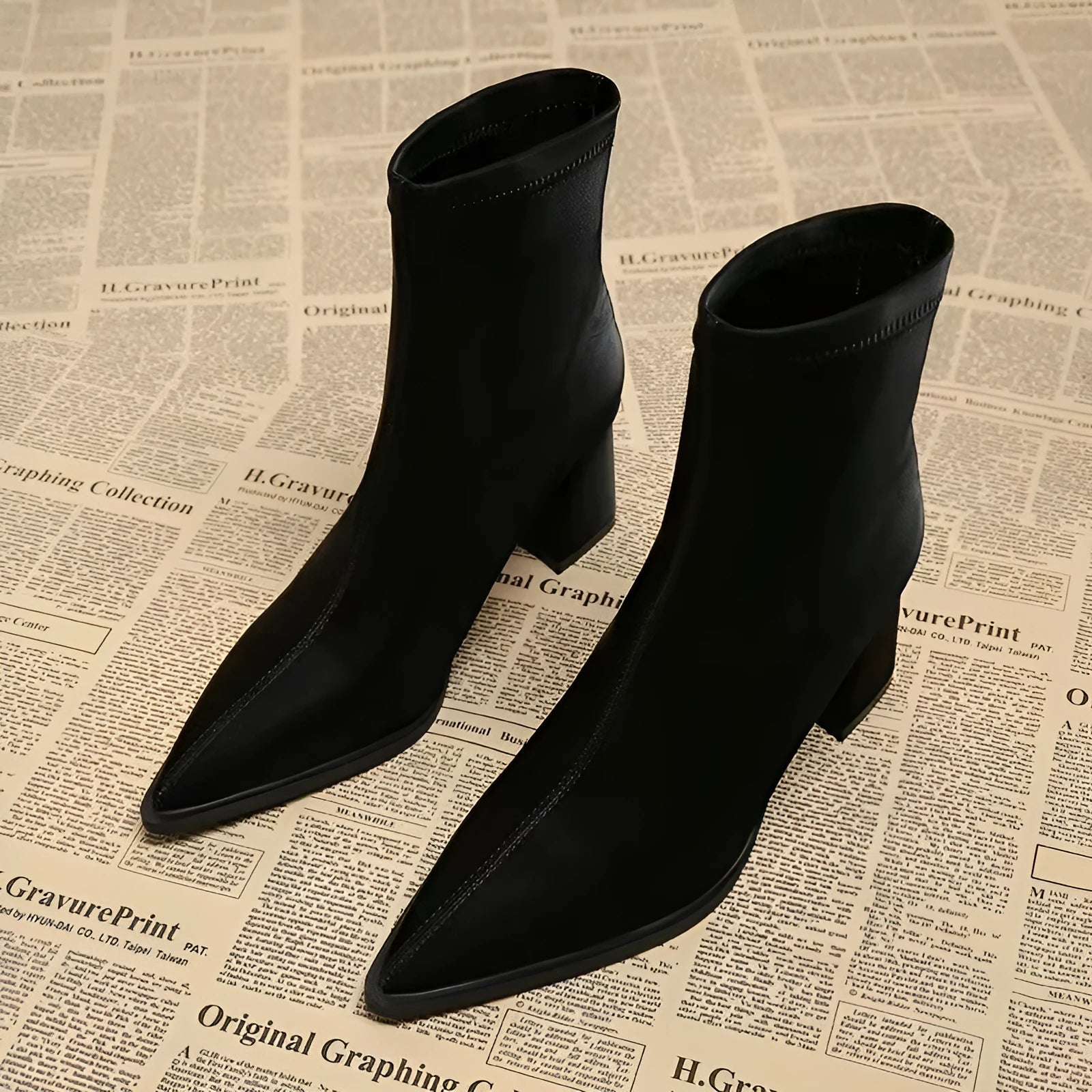 Women's pointed toe boots in stretch artificial suede with mid-heel wedge design