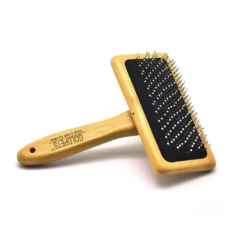 Goldpets bamboo wood slicker brush for pets with stainless steel pins on a wooden handle.