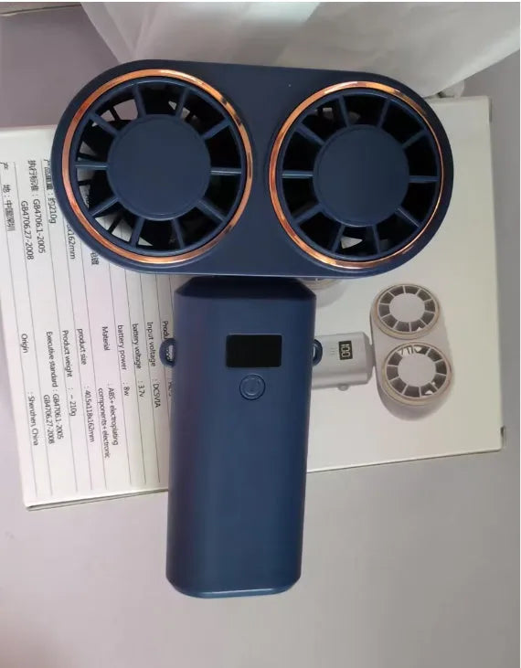 USB handheld mini fan with folding design and digital display screen showing battery level