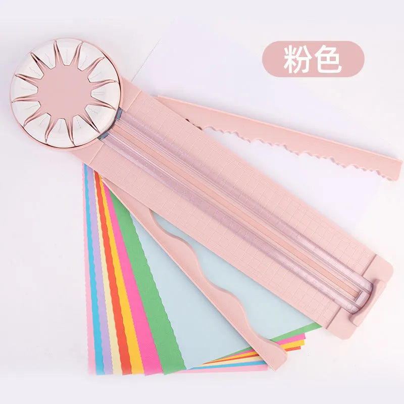 Pink and black 12-in-1 multifunctional plastic paper cutting machine on a white background.