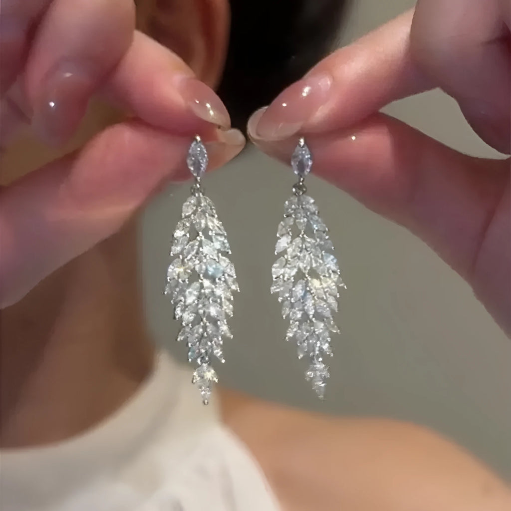 Silver anti-allergy auricular needle earrings with Japanese Korean style New Year design on alloy base