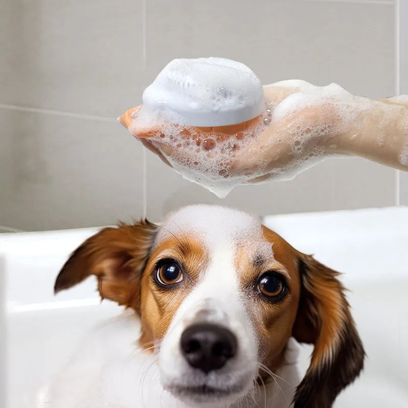 Orange TPR pet bath brush with shampoo dispenser and silicone bristles for dog and cat grooming