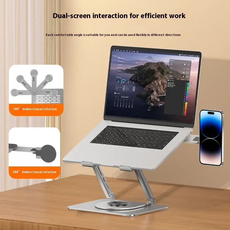 Silver carbon steel laptop stand with a rotating base and a side-mounted magnetic mobile phone holder.
