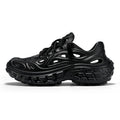 Men's black perforated EVA sandals with a thick sole and covered heel on a wooden deck.
