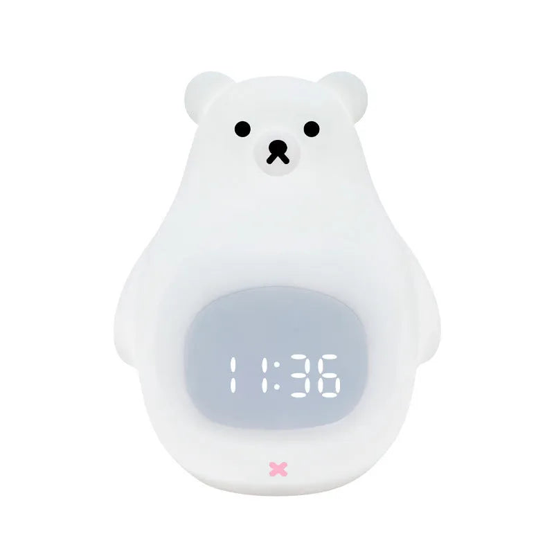 White cartoon bear silicone night light with remote control on a surface.