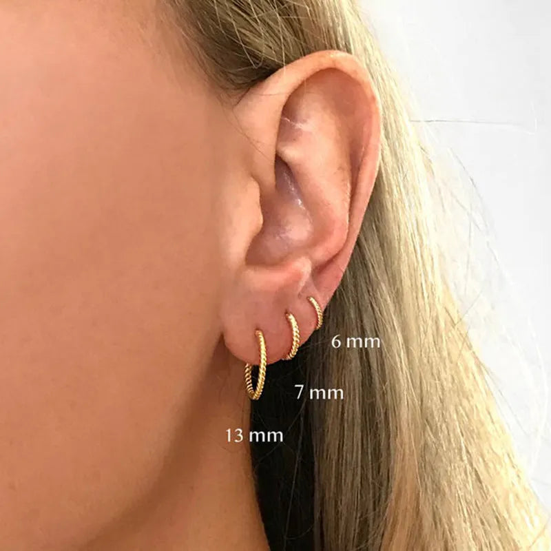 Twisted string round ring earrings in sterling silver with gold plating